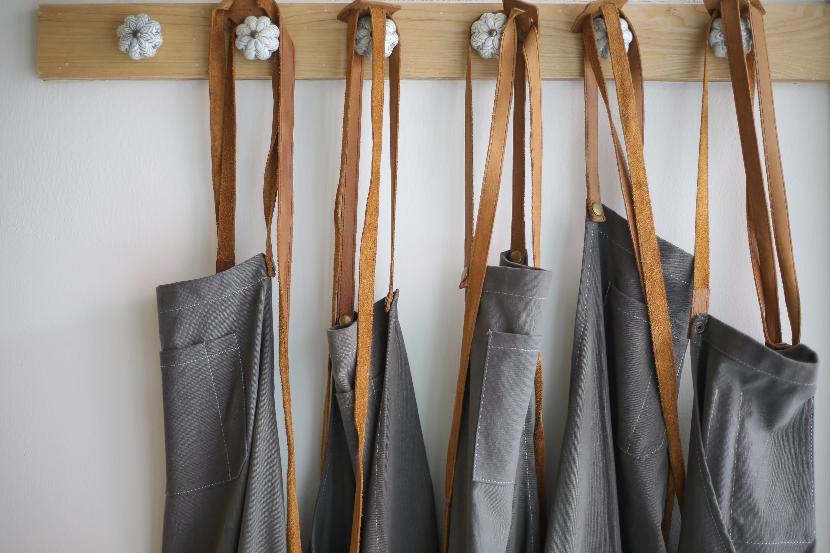 A well lit photo of kitchen clothing, ready to be sold.