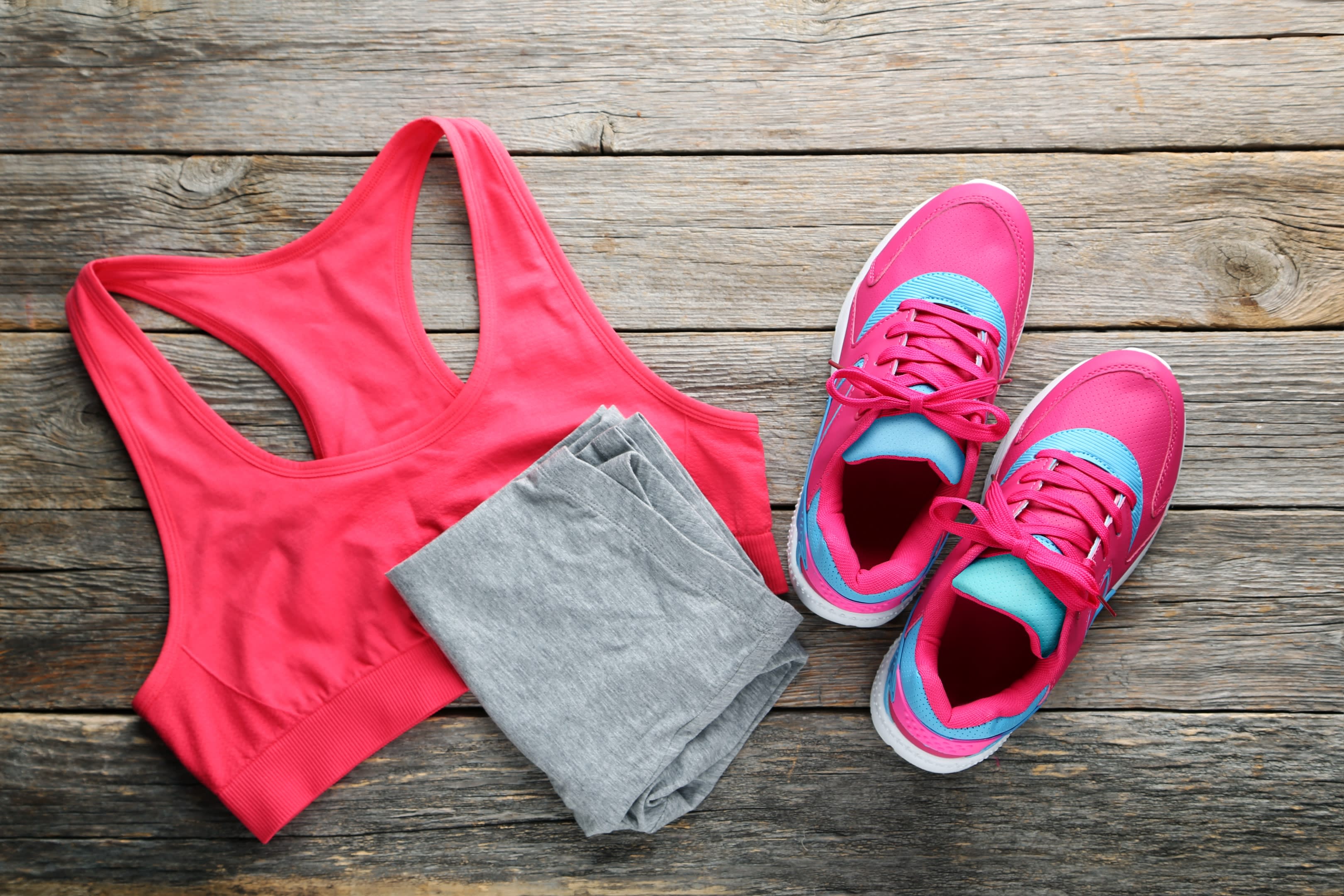 A sports bra, shorts, and running shoes expertly arranged for Product Photography